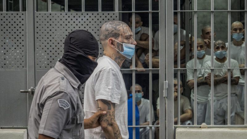 A member of the MS13 gang being escorted back to their cell at the CECOT Mega-Prison in El Salvador. | Juan Carlos/ZUMAPRESS/Newscom