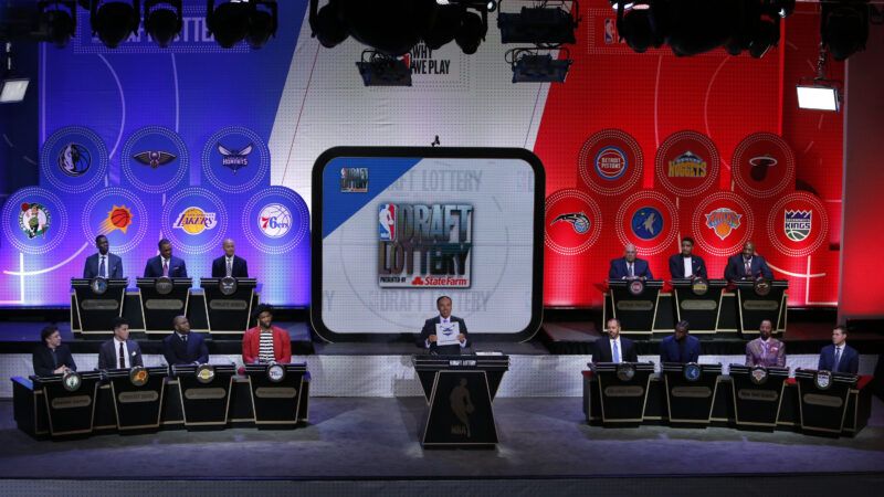 The stage for the 2017 NBA Draft Lottery, with podiums and representatives for each team in the lottery, and a wall behind them with their logos. | Charles Wenzelberg/NY Post/MEGA / Newscom/DBNYC/Newscom