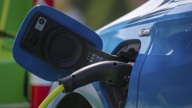 A blue electric vehicle being recharged | imageBROKER/Udo Herrmann/Newscom