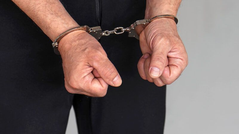 Close-up of an older man's hands in handcuffs. | Svershinsky | Dreamstime.com