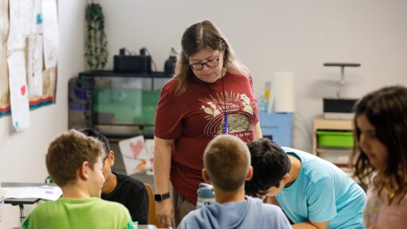 Teacher and students in a school | Jefferee Woo/ZUMA Press/Newscom