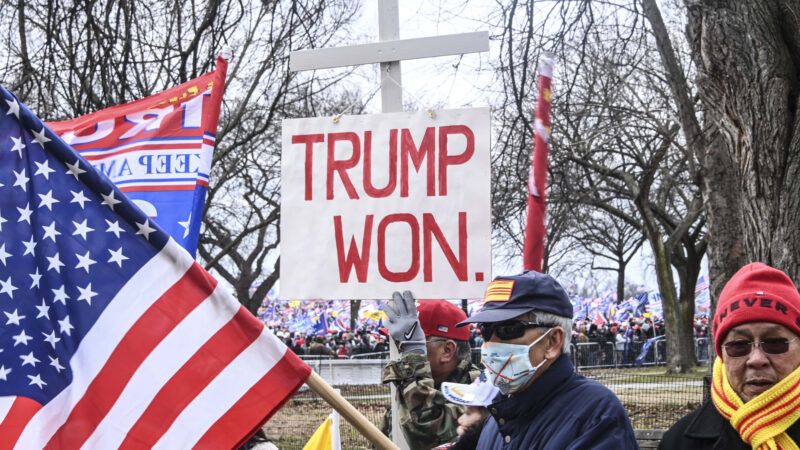 A shot from the pro-Trump rally before the January 6, 2021 Capitol Riot. In the picture, a giant white cross and a rally sign that reads "Trump won" can be seen | J.M. Giordano/ZUMAPRESS/Newscom