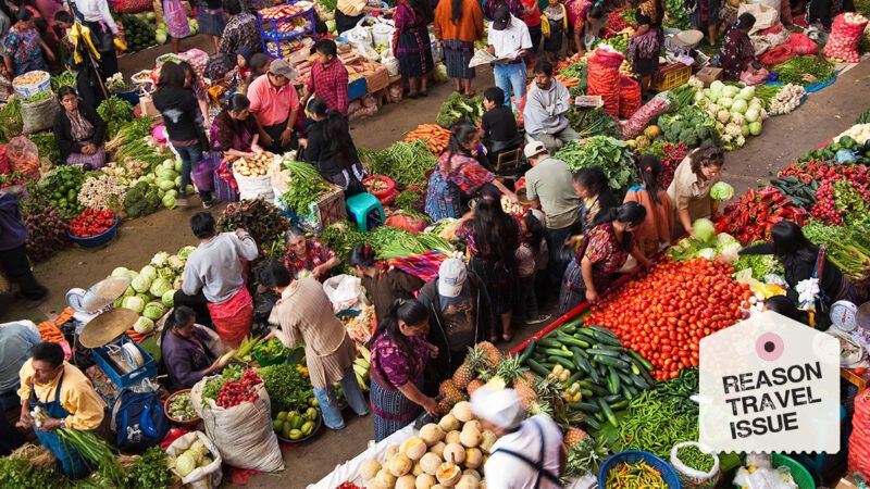 People buying and selling vegetables at a market in Guatemala is seen from above | robertharding/Alamy