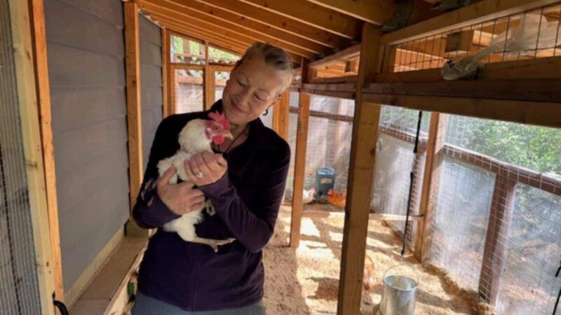 Kathryn Sarkisian holding a chicken | Pacific Legal Foundation
