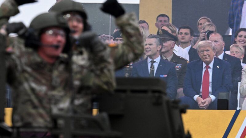 Trump and Hegseth in background of military parade | Kenny Holston - Pool via CNP / MEGA / Newscom/RSSIL/Newscom