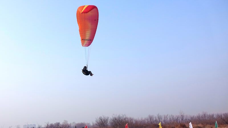 A paraglider in the sky. A paraglider in the sky. | Jinfeng Zhang | Dreamstime.com