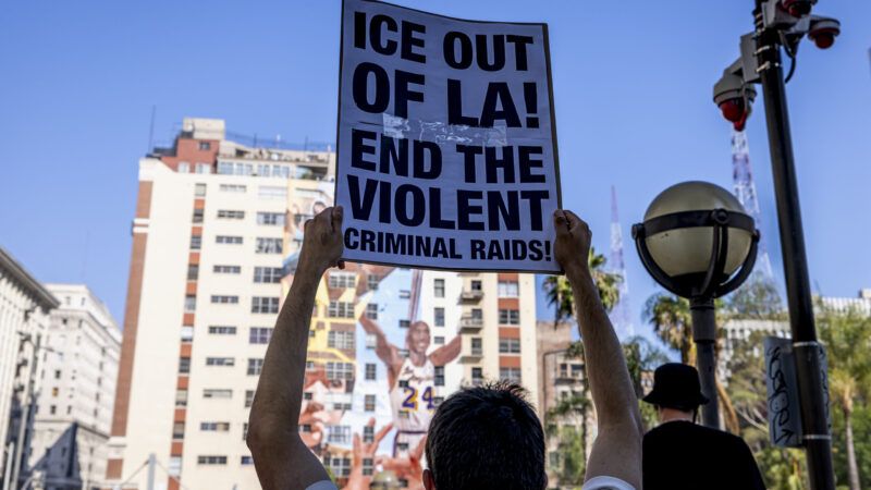 Protestor holding a sign that read, "ICE OUT OF LA! END THE VIOLENT CRIMINAL RAIDS!" | Michael Nigro/Sipa USA/Newscom