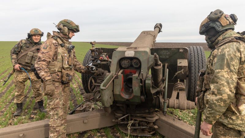 An artillery crew is seen preparing a 122mm howitzer D-30 for firing. | Mykhaylo Palinchak/ZUMAPRESS/Newscom