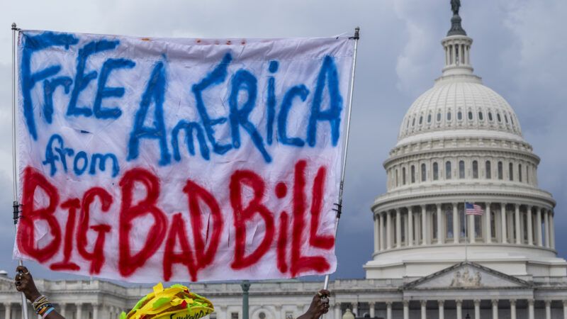 A protestor holds up a sign that says "Free American from Big Bad Bill" | Eric Kayne/ZUMAPRESS/Newscom