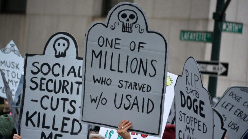 Protestor sign that reads, "One of millions who starved w/o USAID" | ID 368328248 ©  Cpenler | Dreamstime.com
