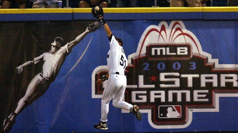 Ichiro reaching out to catch a baseball in his glove, mirroring an image of a player on the wall, with the 2003 All-Star Game logo in the background. Ichiro reaching out to catch a baseball in his glove, mirroring an image of a player on the wall, with the 2003 All-Star Game logo in the background. | JEFFERY PHELPS/KRT/Newscom