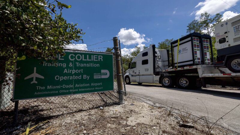 A truck drives past an entry sign for the Dade-Collier Training and Transition Airport | D.A. Varela/TNS/Newscom