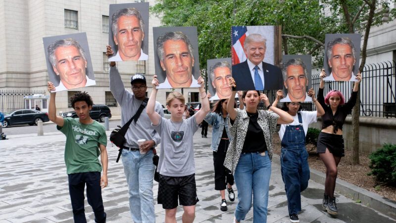 Protestors holding signs of Jeffrey Epstein and Donald Trump | Luiz C. Ribeiro/TNS/Newscom