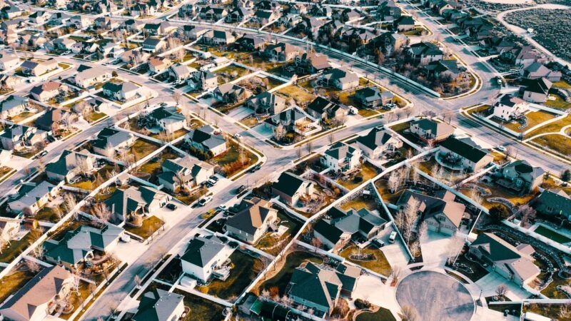 An aerial view of a residential neighborhood | Photo by Michael Tuszynski on Unsplash
