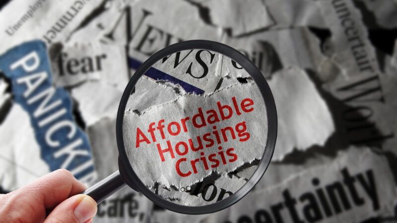 A stack of headlines with a magnifying glass highlighting the words "affordable housing crisis" |  Zimmytws/Dreamstime.com