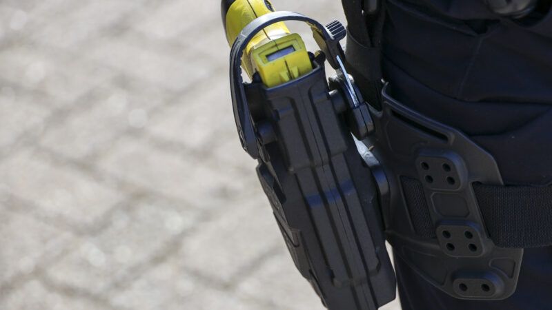 Close-up of a Taser in a holster attached to a police officer's belt. | André Muller | Dreamstime.com