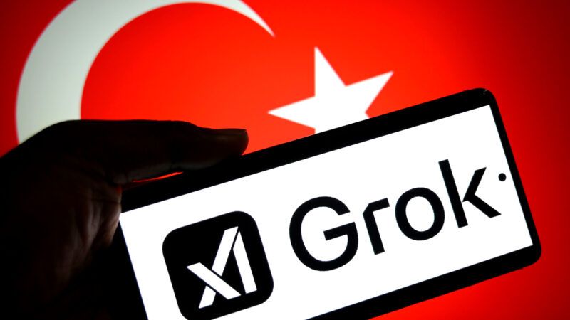 A cell phone displaying the xAI Grok logo, against the backdrop of the national flag of Turkey. | Avishek Das/ZUMAPRESS/Newscom