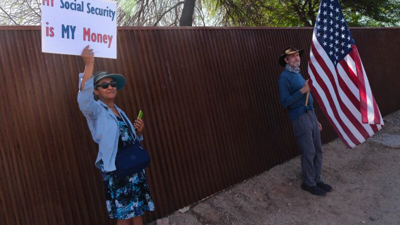 A protester holds up a sign that says "My Social Security Is My Money." | Christopher Brown/ZUMAPRESS/Newscom