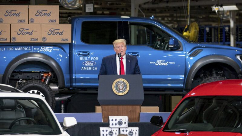 President Donald Trump in front of Ford cars | Tia Dufour/White House/ZUMA Press/Newscom