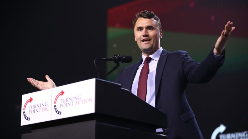 Charlie Kirk speaks at a political event behind a lectern with Turning Point USA logos. | Gage Skidmore/ZUMAPRESS/Newscom