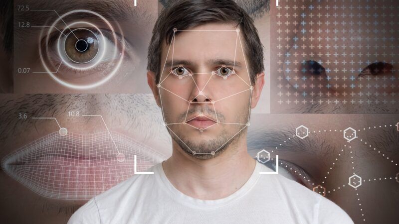A facial recognition program analyzes a man's face. | Vchalup | Dreamstime.com