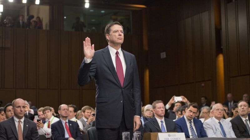 Former FBI Director James Comey raises his right hand to be sworn in to testify before a Senate committee hearing in 2017. | Ron Sachs/CNP / Polaris/Newscom