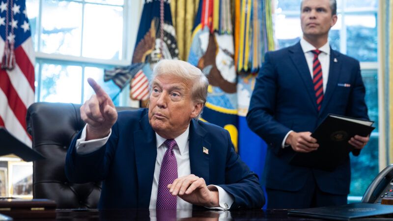 Trump sits in the Oval Office with Pete Hegseth standing behind him | Francis Chung - Pool via CNP/CNP / Polaris/Newscom
