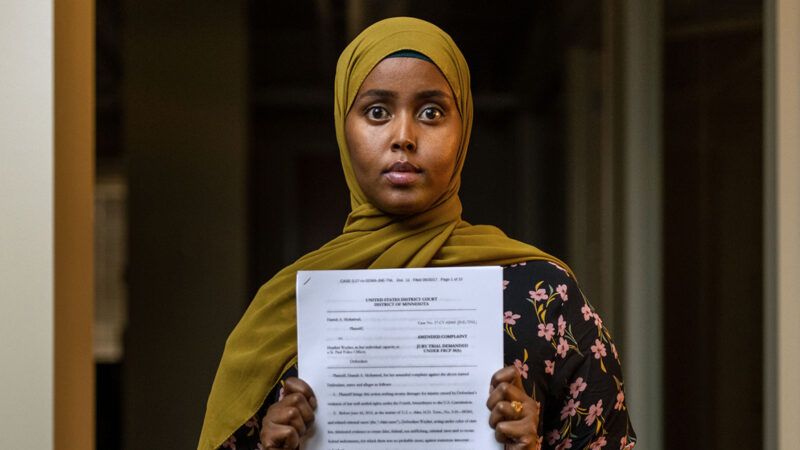 Hamdi Mohamud holding a court document | Photo: Hamdi Mohamud/Institute for Justice