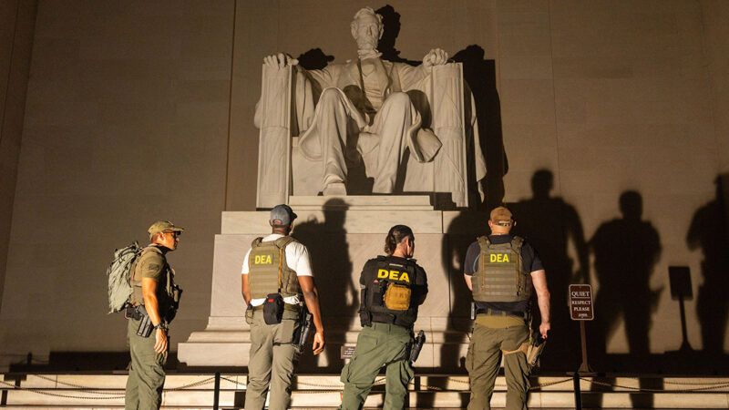 DEA agents standing around the Lincoln Memorial | Photo: Alex Kent/The Washington Post/Getty Images