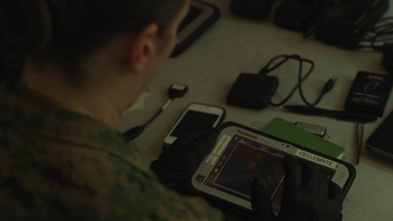 A criminal investigator with 2nd Law Enforcement Battalion (LE Bn), II Marine Expeditionary Force, Information Group extracts data from electronic devices with the Cellebrite tablet during an exercise in LZ Phoenix, N.C., May 20, 2019. A criminal investigator with 2nd Law Enforcement Battalion (LE Bn), II Marine Expeditionary Force, Information Group extracts data from electronic devices with the Cellebrite tablet during an exercise in LZ Phoenix, N.C., May 20, 2019. | U.S. Marine Corps photo by Sgt. Luisa Torres