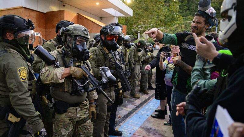 Federal agents confront protesters outside the ICE building in Portland, Oregon. | Mathieu Lewis-Rolland/Sipa USA/Newscom