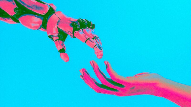 A robot hand and a human hand about to hold hands A robot hand and a human hand about to hold hands | Photo by <a href="https://unsplash.com/@cashmacanaya?utm_source=unsplash&utm_medium=referral&utm_content=creditCopyText">Cash Macanaya</a> on <a href="https://unsplash.com/photos/two-hands-reaching-for-a-flying-object-in-the-sky-X9Cemmq4YjM?utm_source=unsplash&utm_medium=referral&utm_content=creditCopyText">Unsplash</a>