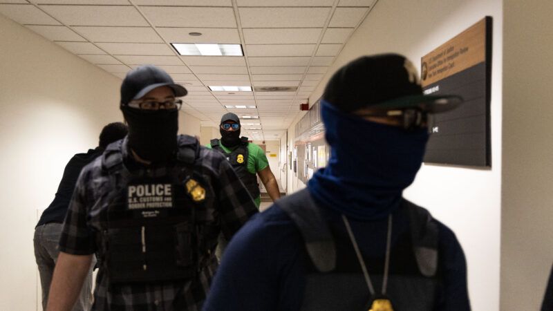 Masked Immigration and Customs Enforcement (ICE) officers in a hallway outside immigration court. Masked Immigration and Customs Enforcement (ICE) officers in a hallway outside immigration court. | Matthew Hoen/ZUMAPRESS/Newscom
