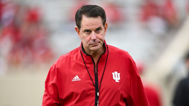 Indiana football coach Curt Cignetti walks toward the camera with a blurred stadium background behind him. | ames Black/Icon Sportswire DHN/James Black/Icon Sportswire/Newscom