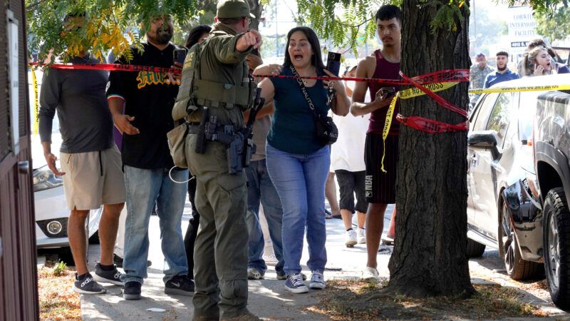 Federal agents with civilians | Peter Tsai/TNS/Newscom