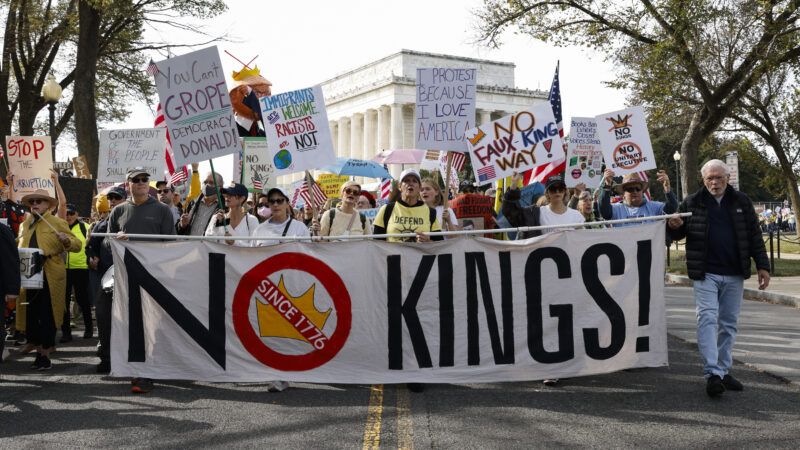Protesters in Washington, D.C., hold up a banner that says "No Kings!" | Aashish Kiphayet/Sipa USA/Newscom