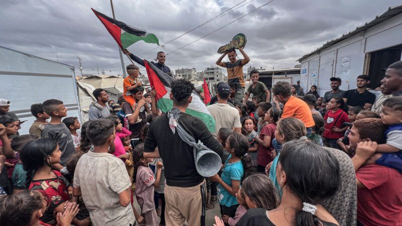 Palestinians celebrate news of a new Gaza ceasefire deal in Nusairat Camp, Gaza on October 9, 2025. | Belal Abu Amer/APAImages / Polaris/Newscom