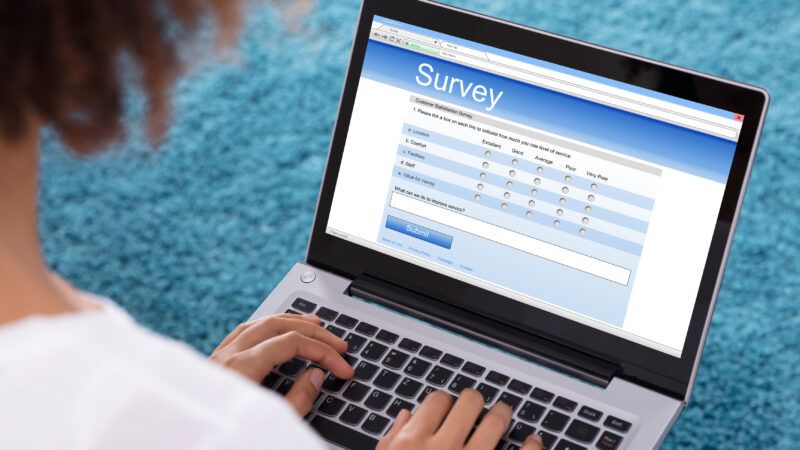 Someone takes a survey on a laptop | Andrey Popov/Dreamstime.com