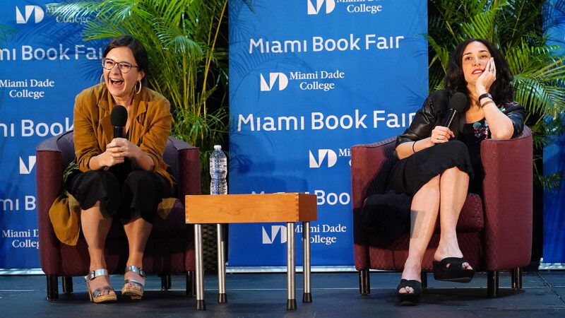 Bari Weiss sits next to someone on stage | Alberto E. Tamargo
