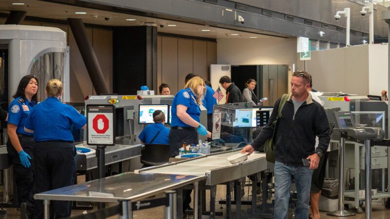 A man passes through a Transportation Security Administration (TSA) airport security checkpoint. | David Tran | Dreamstime.com