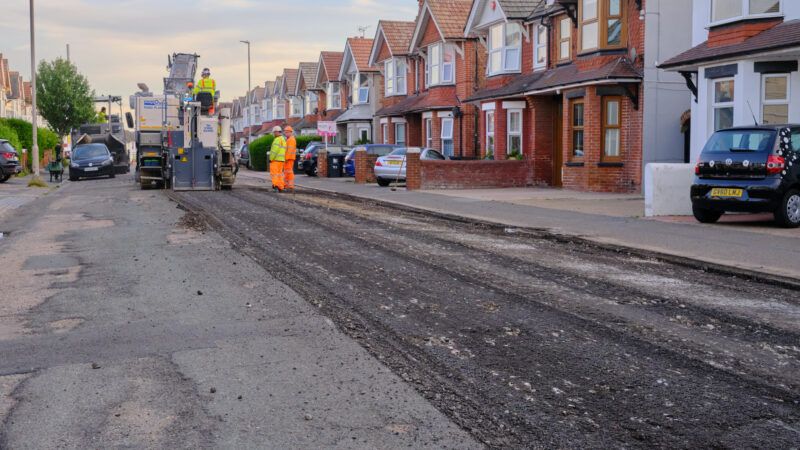 Eastbourne, U.K.—July 11, 2022: Road resurfacing repairs in a residential area | ID 282539709 © Nigel Wiggins | Dreamstime.com