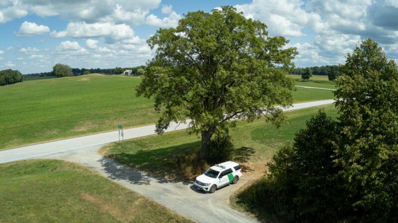 Aerial view of a U.S. Border Patrol vehicle patrolling the area near Richford, Vermont, August 21, 2025. | Polaris/Newscom