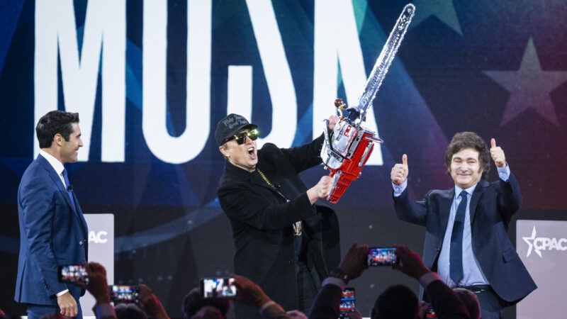 Elon Musk holding a chainsaw next to Javier Milei | Graeme Sloan/Sipa USA/Newscom
