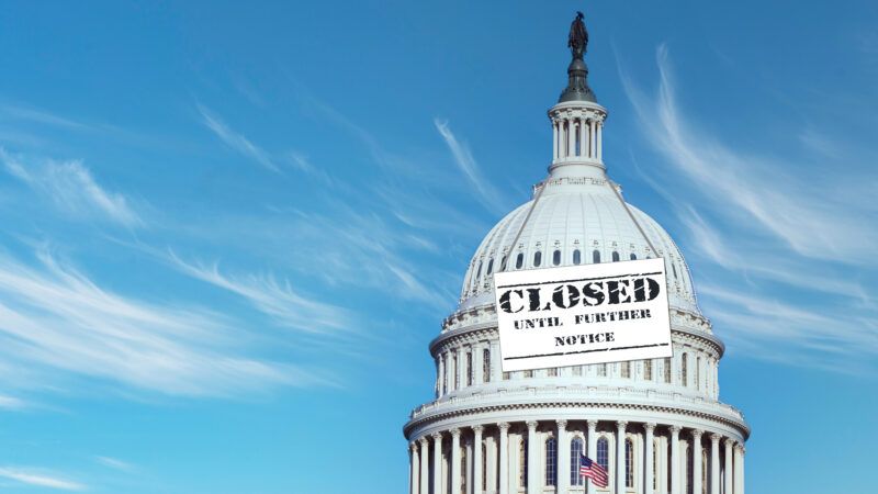 The U.S. Capitol against a blue sky. A sign draped around the Capitol dome says "Closed Until Further Notice." | Rickk6rj | Dreamstime.com