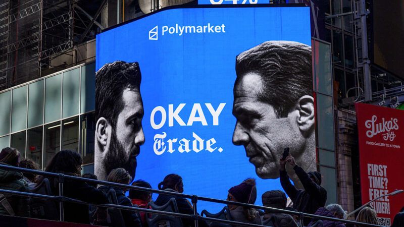 A Polymarket billboard showing Zohran Mamdani and Andrew Cuomo | Photo: Adam Gray/Bloomberg/Getty