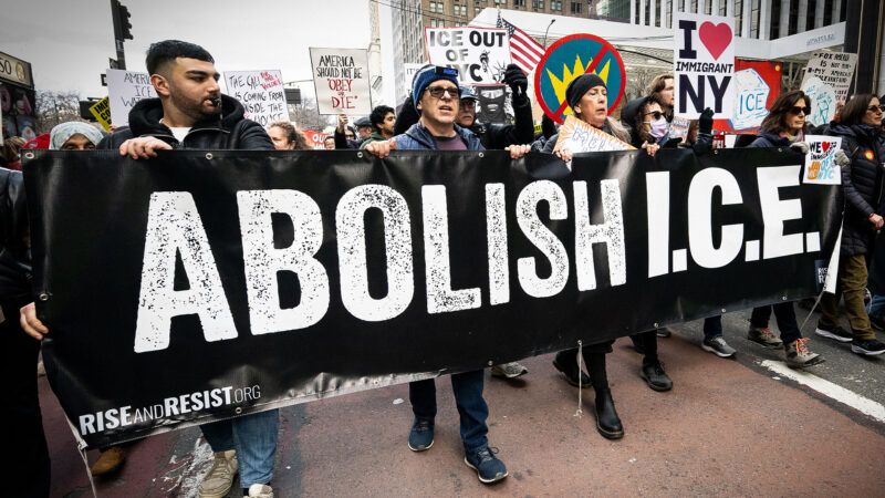 Protesters march with a black banner that reads "Abolish I.C.E." | Michael Brochstein/Sipa USA/Newscom