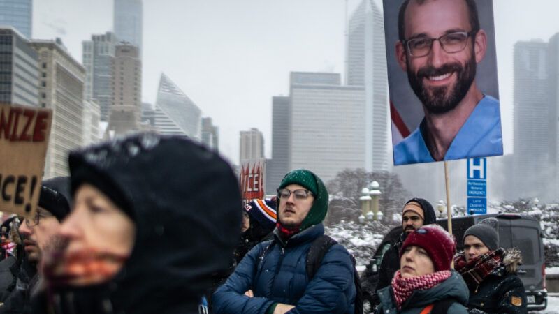 Protesters carrying sign with Alex Pretti's image on it | Nima Taradji/Polaris/Newscom