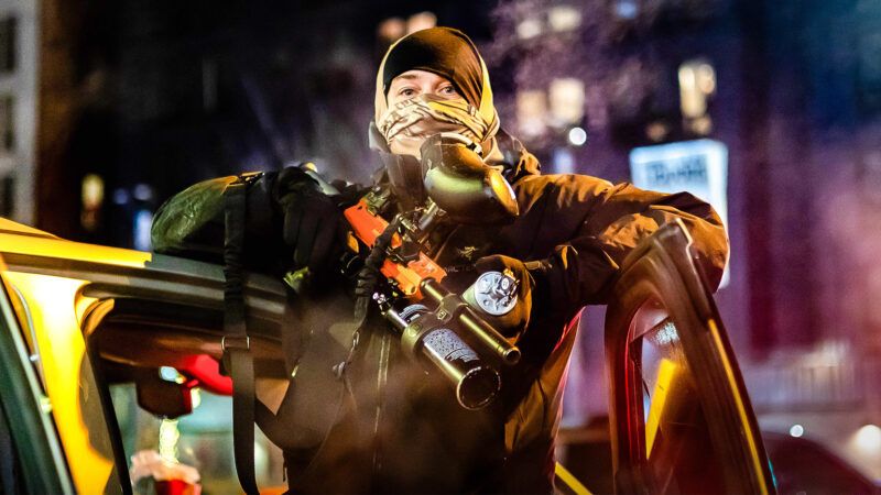 An armed, masked protester | Tom Hudson/ZUMAPRESS/Newscom