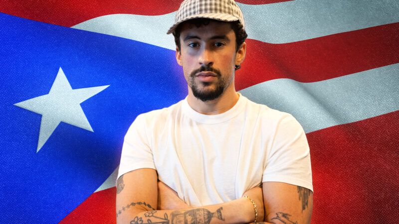 Bad Bunny with the Puerto Rican flag behind him | Credit: Xavier Araújo/Newscom/Envato