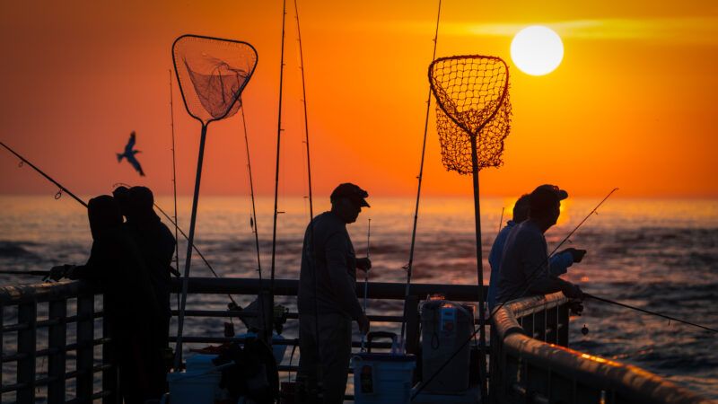 a fishing boat at sunset | Ronen Tivony/ZUMAPRESS/Newscom